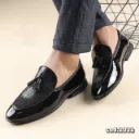 Classic loafers crafted from glossy leather with a checkered pattern