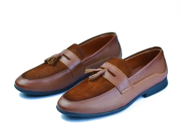 Penny loafers made from a blend of genuine leather and suede