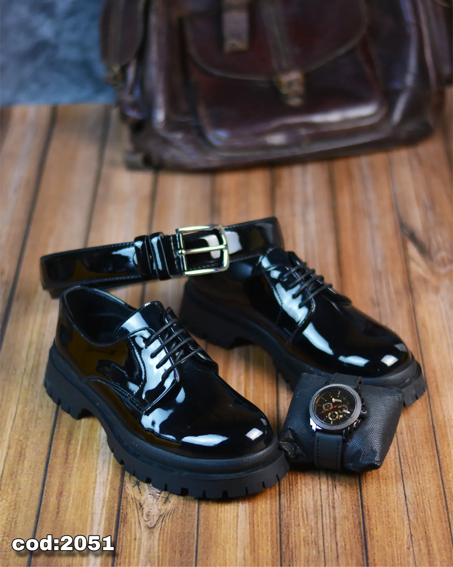 Chunky lace-up shoes made from glossy leather with a rubber sole