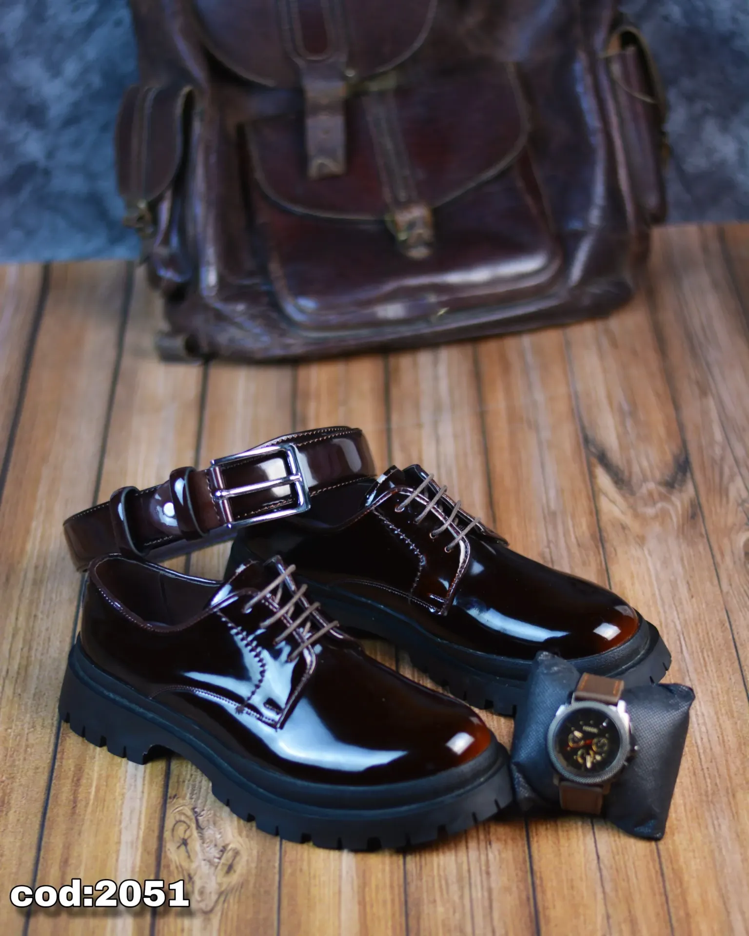 Chunky lace-up shoes made from glossy leather with a rubber sole