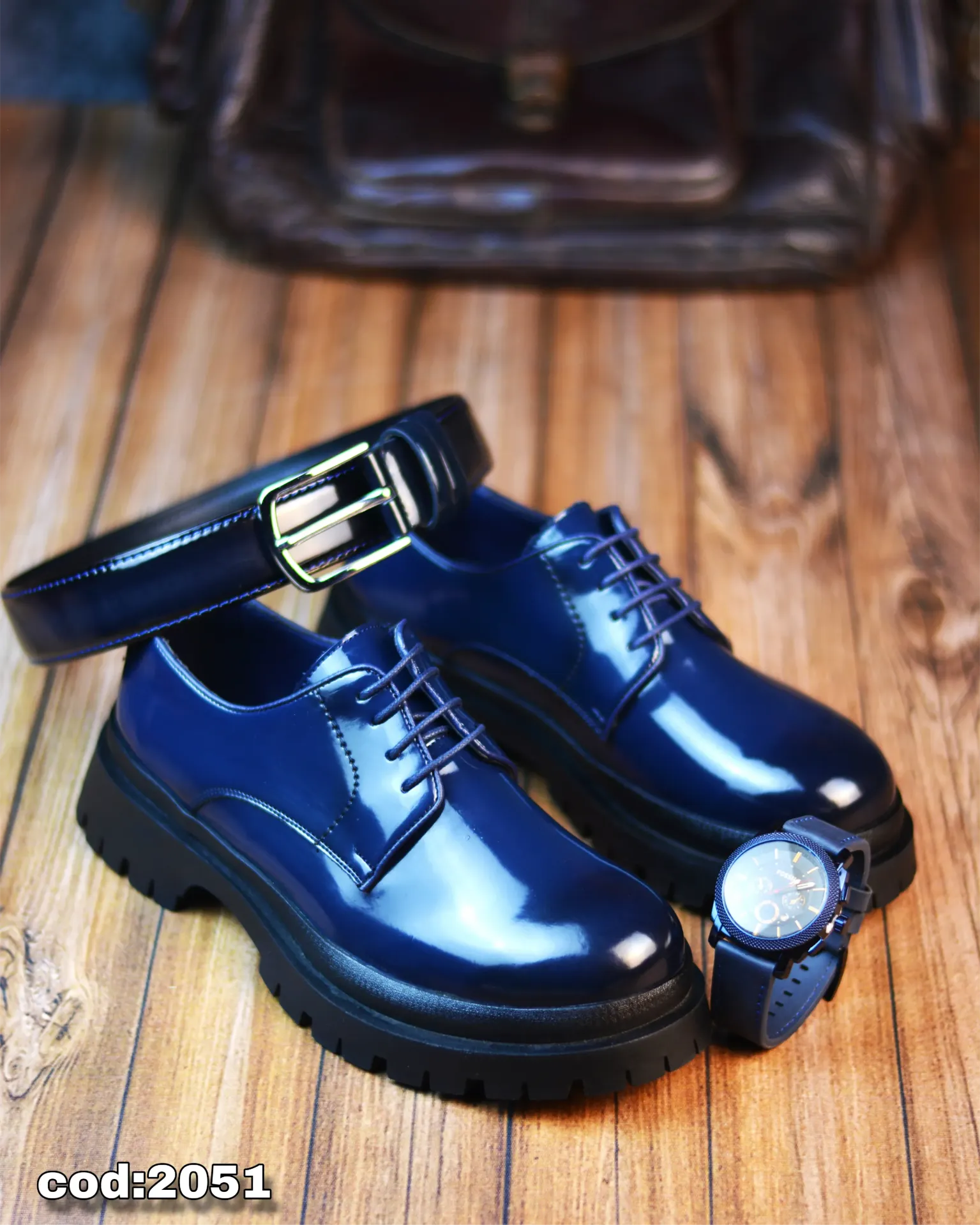 Chunky lace-up shoes made from glossy leather with a rubber sole