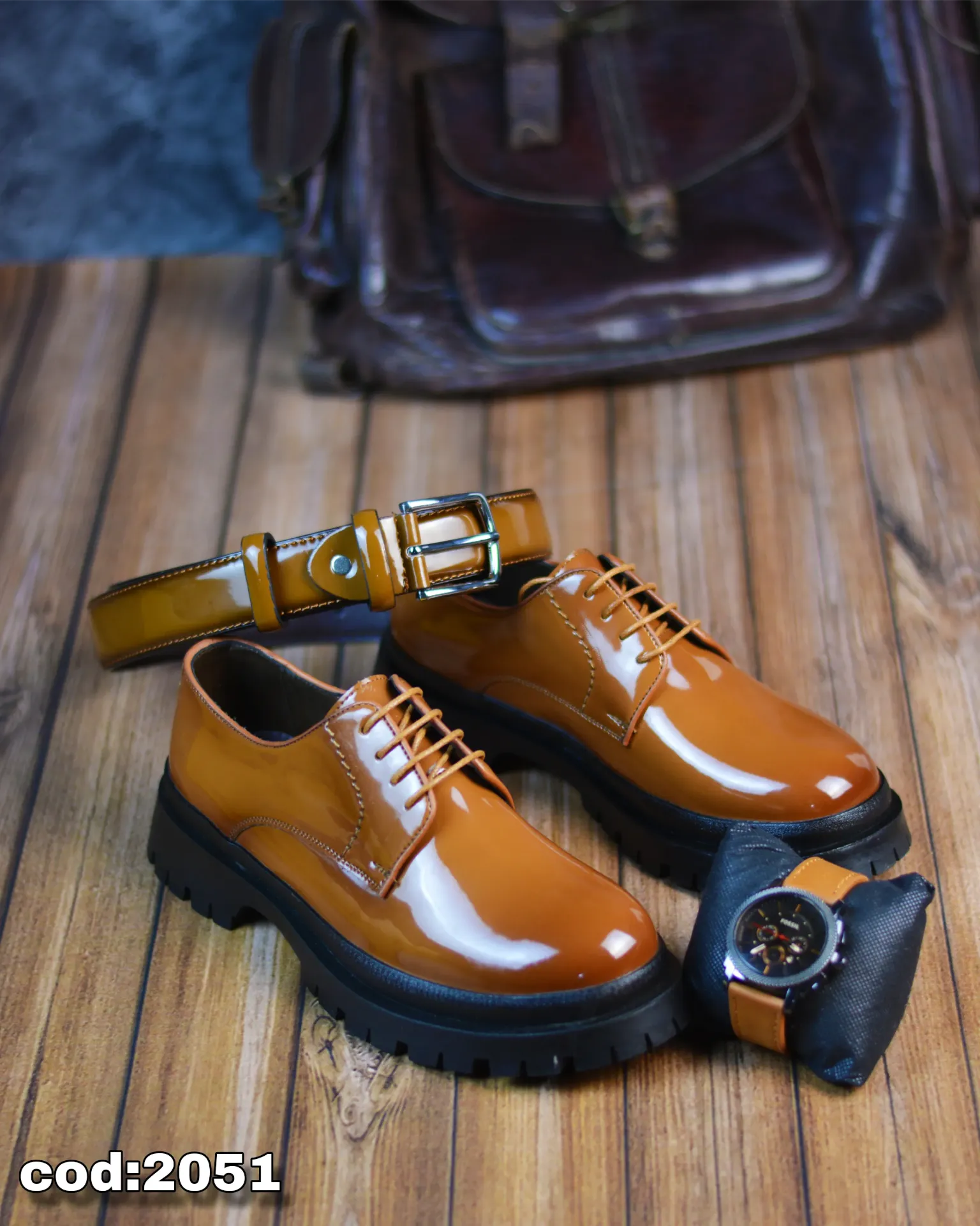 Chunky lace-up shoes made from glossy leather with a rubber sole